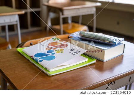 A Japanese textbook and dictionary on a desk in a classroom A Japanese textbook and dictionary on a desk in a classroom 123364010