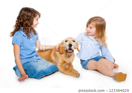 kid girls with Golden retriever puppy isolated 123364029