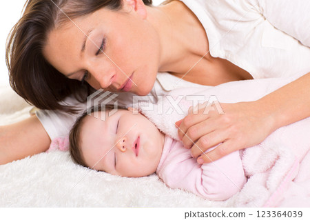Baby girl sleeping with mother care near Baby girl sleeping with mother care near 123364039