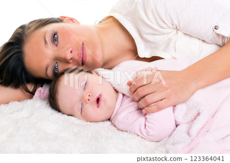 Baby girl sleeping with mother care near Baby girl sleeping with mother care near 123364041