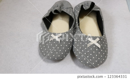 Women's room shoes placed on a white background 123364331