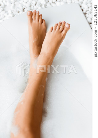 Relaxation In Bathroom. Woman Legs In Bath With Soap Foam, Top View 123365142
