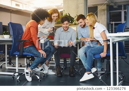 Young creative team discussing new project, working in modern coworking space 123366276