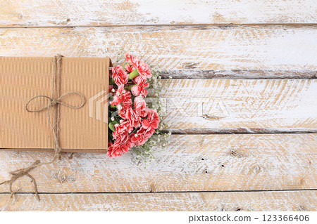Carnations in a box, abstract spring floral background. Creative modern bouquet, minimal holiday concept. Postcard for womens day or mothers day, happy birthday, wedding, banner for the screen, Carnations in a box, abstract spring floral background. Creative modern bouquet, minimal holiday concept. Postcard for womens day or mothers day, happy birthday, wedding, banner for the screen, 123366406