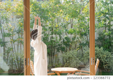 Woman relaxing on the veranda Woman relaxing on the veranda 123366772