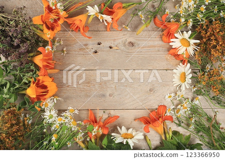 Abstract flower arrangement, still life, autumn banner, lilies, St. John's wort, oregano, mint and chamomile on a wooden background. Mother's day card, womens day, valentine's day, happy birthday, Abstract flower arrangement, still life, autumn banner, lilies, St. John's wort, oregano, mint and chamomile on a wooden background. Mother's day card, womens day, valentine's day, happy birthday, 123366950