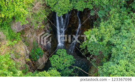 Feb 22 2025 Waterfall Surrounded by Lush Greenery in a Scenic Nature Setting Feb 22 2025 Waterfall Surrounded by Lush Greenery in a Scenic Nature Setting 123367096