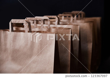 Brown paper bags on a black background Brown paper bags on a black background 123367097