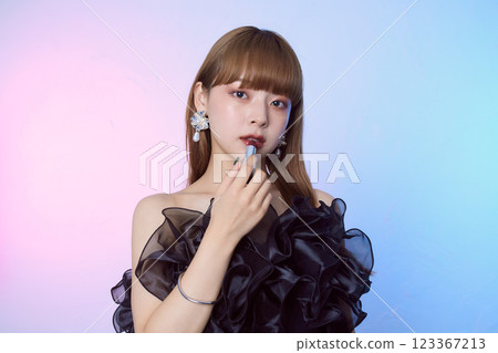 A woman in a black dress 123367213