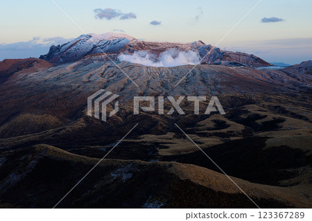 Mt. Aso in winter, emitting smoke; volcanic landscape 123367289