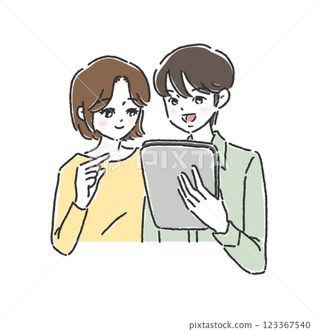 Two people looking at a tablet 123367540
