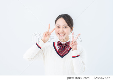 High school girl making a peace sign High school girl making a peace sign 123367856
