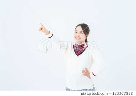 A high school girl smiling and pointing at her goal 123367858