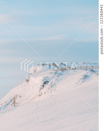 The Kitadaisetsu mountain range at sunrise as seen from Mount Asahi 123368441