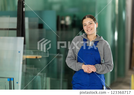 Young woman working in glass factory 123368717
