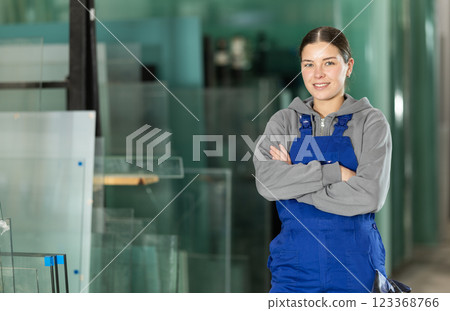 Young woman working in glass factory 123368766