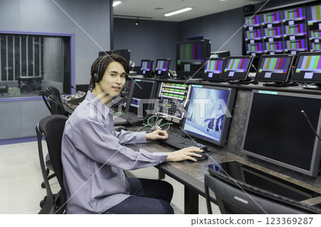 A director working in a TV station's control room. Filming cooperation: SKY Perfect TV Tokyo Media Center A director working in a TV station's control room. Filming cooperation: SKY Perfect TV Tokyo Media Center 123369287
