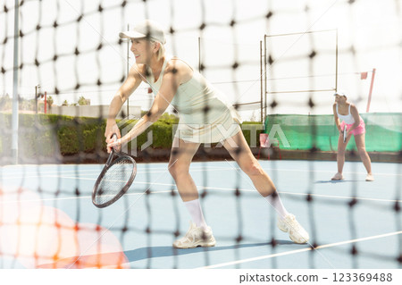Senior woman plays tennis Senior woman plays tennis 123369488