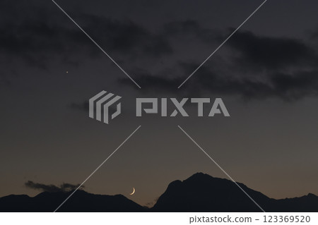 Hakushu Town, Hokuto City, Mount Kaikoma in the Southern Alps, a thin moon setting at dusk 123369520