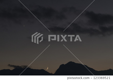 Hakushu Town, Hokuto City, Mount Kaikoma in the Southern Alps, a thin moon setting at dusk 123369521
