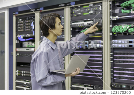 A young man working in front of the equipment in a TV station's control room. Filming courtesy of Sky Perfect TV Tokyo Media Center A young man working in front of the equipment in a TV station's control room. Filming courtesy of Sky Perfect TV Tokyo Media Center 123370200