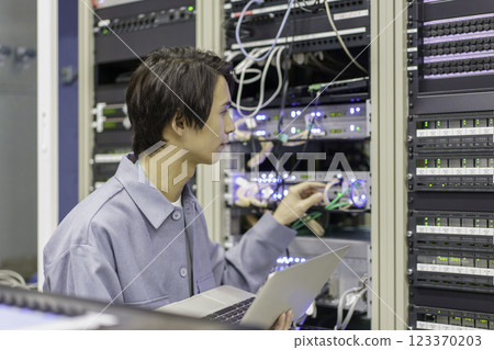 A young man working in front of the equipment in a TV station's control room. Filming courtesy of Sky Perfect TV Tokyo Media Center A young man working in front of the equipment in a TV station's control room. Filming courtesy of Sky Perfect TV Tokyo Media Center 123370203