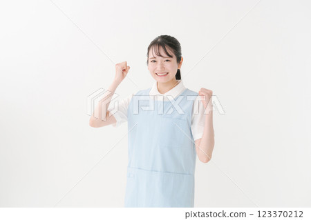 Caregiver in apron Caregiver in apron 123370212
