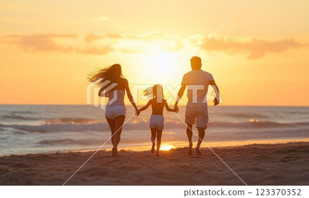 Family silhouette on the beach at sunset 123370352