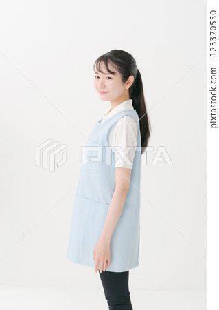 Portrait of a caregiver in an apron 123370550