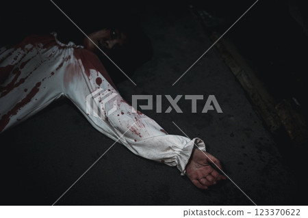 Closeup hand with blood of horror bloodthirsty ghost woman on floor Closeup hand with blood of horror bloodthirsty ghost woman on floor 123370622