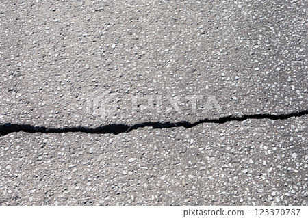 Image of cracks in asphalt Image of cracks in asphalt 123370787