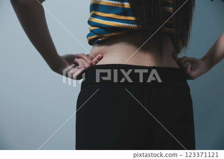 Women body fat belly. Obese woman hand holding excessive belly fat. diet lifestyle concept to reduce belly and shape up healthy stomach muscle. Women body fat belly. Obese woman hand holding excessive belly fat. diet lifestyle concept to reduce belly and shape up healthy stomach muscle. 123371121