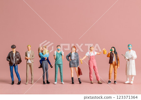 Miniature figurines of women representing diverse professions ,A perfect visual for International Women Day 123371364