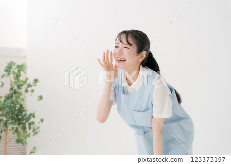 Caregiver in apron Caregiver in apron 123373197
