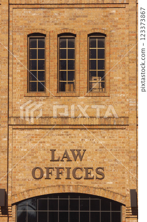 Law Offices Sign on Brick Wall in Downtown Tyler TX Law Offices Sign on Brick Wall in Downtown Tyler TX 123373867