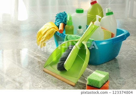 Household cleaning products and items for cleaning tile in house. Cleaning and cleanliness. Household cleaning products and items for cleaning tile in house. Cleaning and cleanliness. 123374804