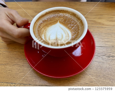 Red cappuccino cup with latte art Red cappuccino cup with latte art 123375959