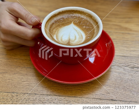 Red cappuccino cup with latte art Red cappuccino cup with latte art 123375977