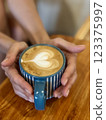 A cup of coffee cappuccino or latte on the table 123375997