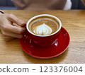 Red cappuccino cup with latte art 123376004