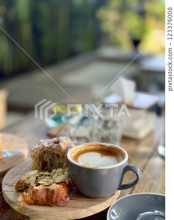 10 November 2024, Indonesia. A cup of coffee cappuccino or latte on the table 10 November 2024, Indonesia. A cup of coffee cappuccino or latte on the table 123376008