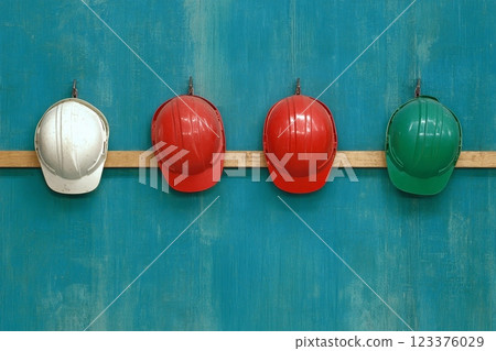 Colorful Safety Helmets on Wooden Rail Against Turquoise Wall ai generative ai generative 123376029
