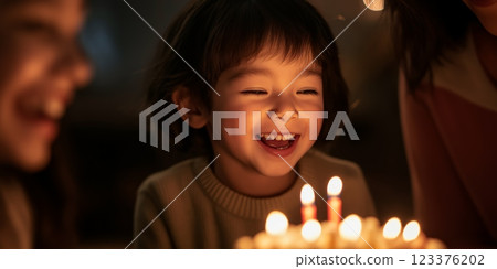 Joyful Child Celebrating Birthday with Candlelit Cake Surrounded by Family and Friends ai generative ai generative 123376202