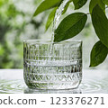 Refreshing Glass of Water with Leaf in Natural Setting for Eco Friendly Concepts ai generative ai generative 123376271