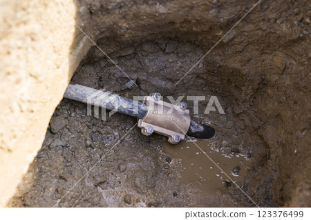 Image of fixing pipes with repair bands 123376499