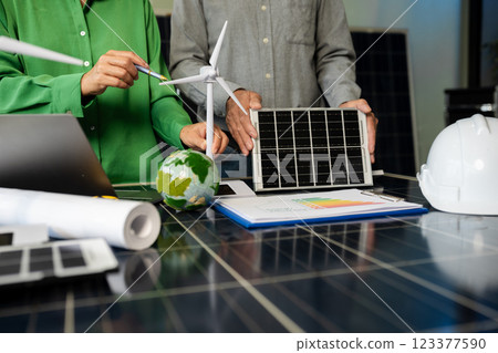 Two colleagues discussing data working and tablet, laptop with on Construction Site project. Two colleagues discussing data working and tablet, laptop with on Construction Site project. 123377590