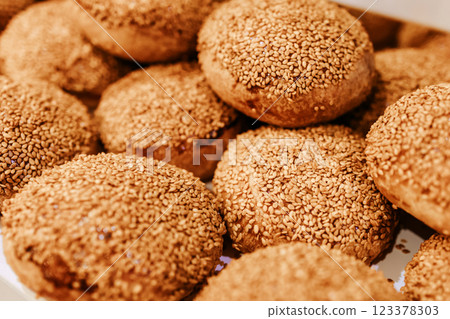 Sweet bun with sesame. Canteen community. Bakery products. Pastry shop. 123378303