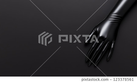 Elegant black glove on sleek dark surface creates striking contrast Elegant black glove on sleek dark surface creates striking contrast 123378561