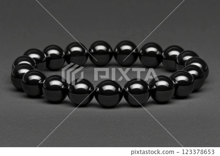 Elegant black bead bracelet showcasing timeless style and simplicity Elegant black bead bracelet showcasing timeless style and simplicity 123378653