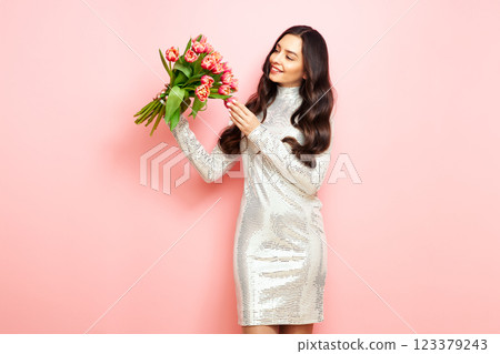 Happy beauty woman with pink tulip bouquet Happy beauty woman with pink tulip bouquet 123379243